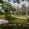 a park with a fence and trees