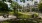 a park with a fence and trees