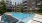 a swimming pool in a courtyard between buildings