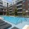 a swimming pool in a courtyard between buildings