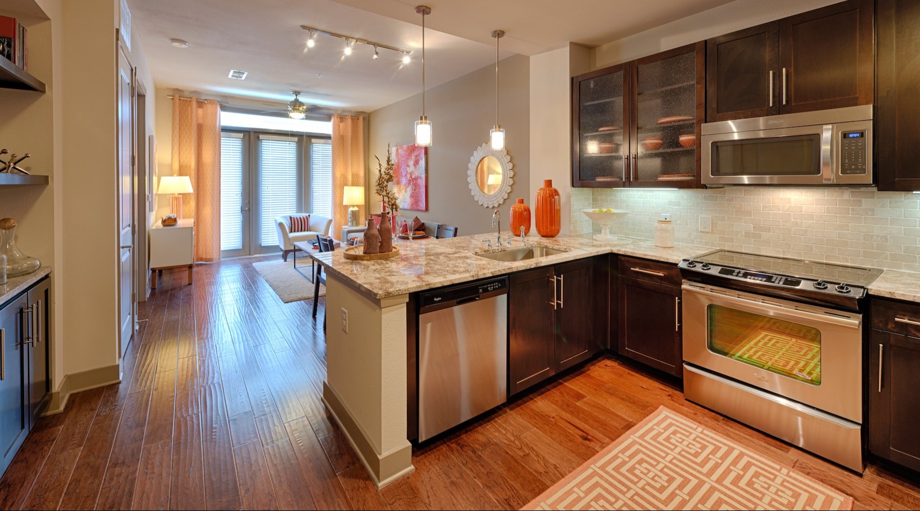 Large well lit kitchen with wood floors 