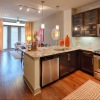 Large well lit kitchen with wood floors 