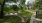 a park with a fence and trees