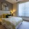 a bedroom with a bed and lamps