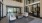 a room with a glass door and a white couch