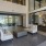 a room with a glass door and a white couch
