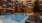 a swimming pool in a courtyard between buildings