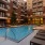 a swimming pool in a courtyard between buildings