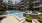 a pool in a courtyard between buildings