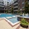 a pool in a courtyard between buildings