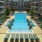 a swimming pool in a courtyard between buildings