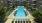 a swimming pool in a courtyard between buildings